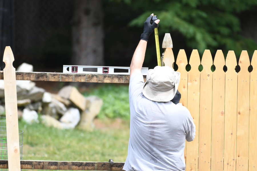 contractor installing wooden fence hamden ct